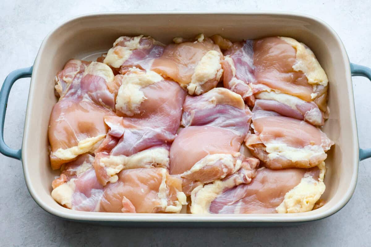 Second photo of the chicken thighs in the pan.