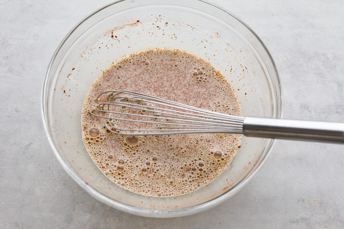 The egg mixture being whisked together.