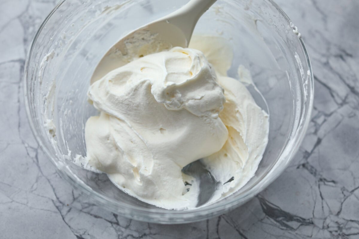 Overhead shot of fully combined cream cheese mixture and whipped cream. 