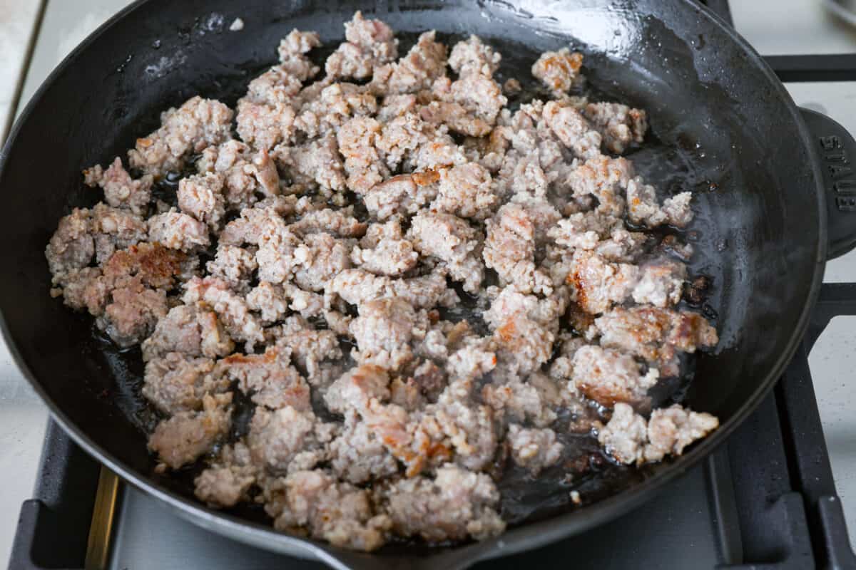 Cooked sausage in a skillet. 