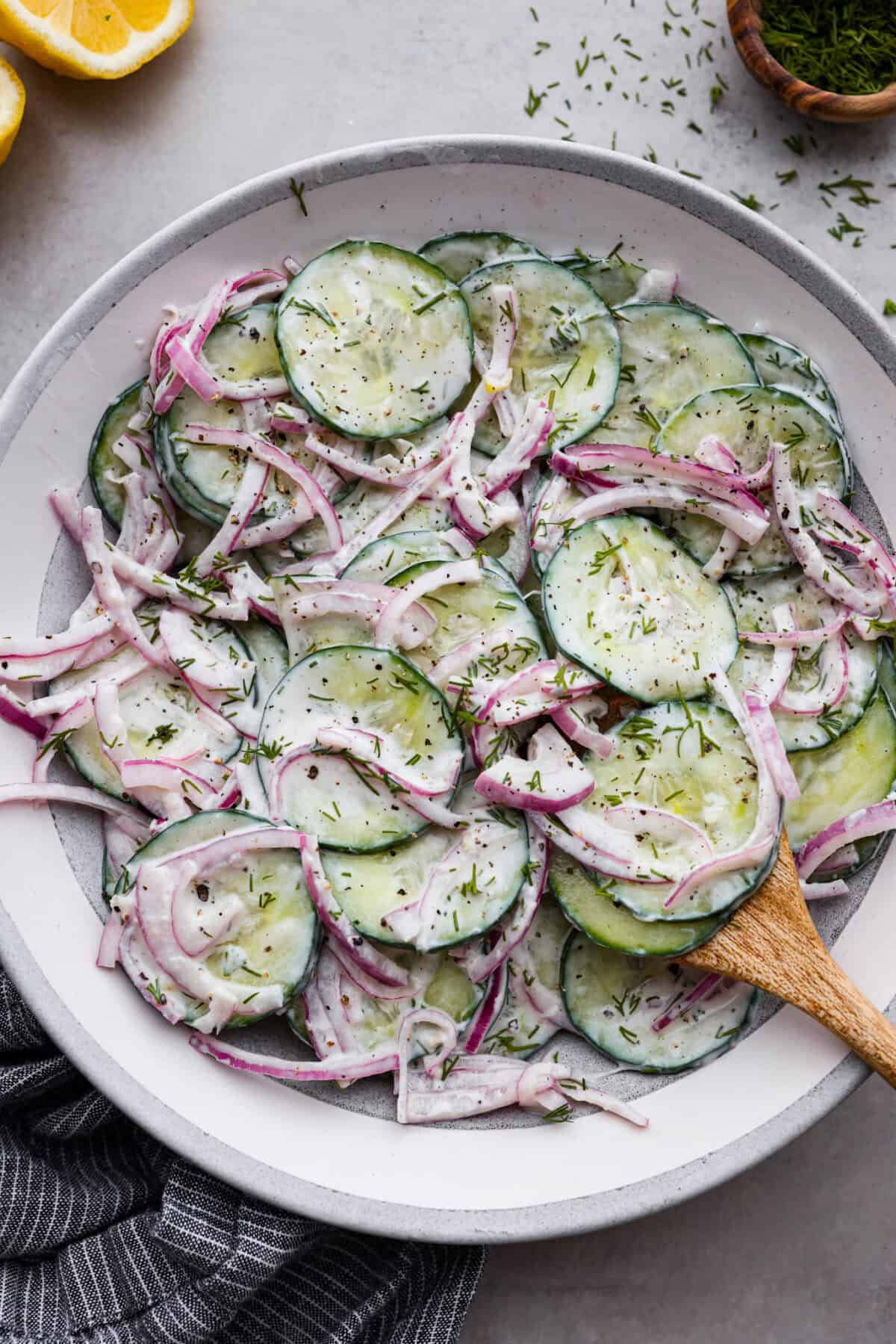 Creamy cucumber salad in a bowl. 