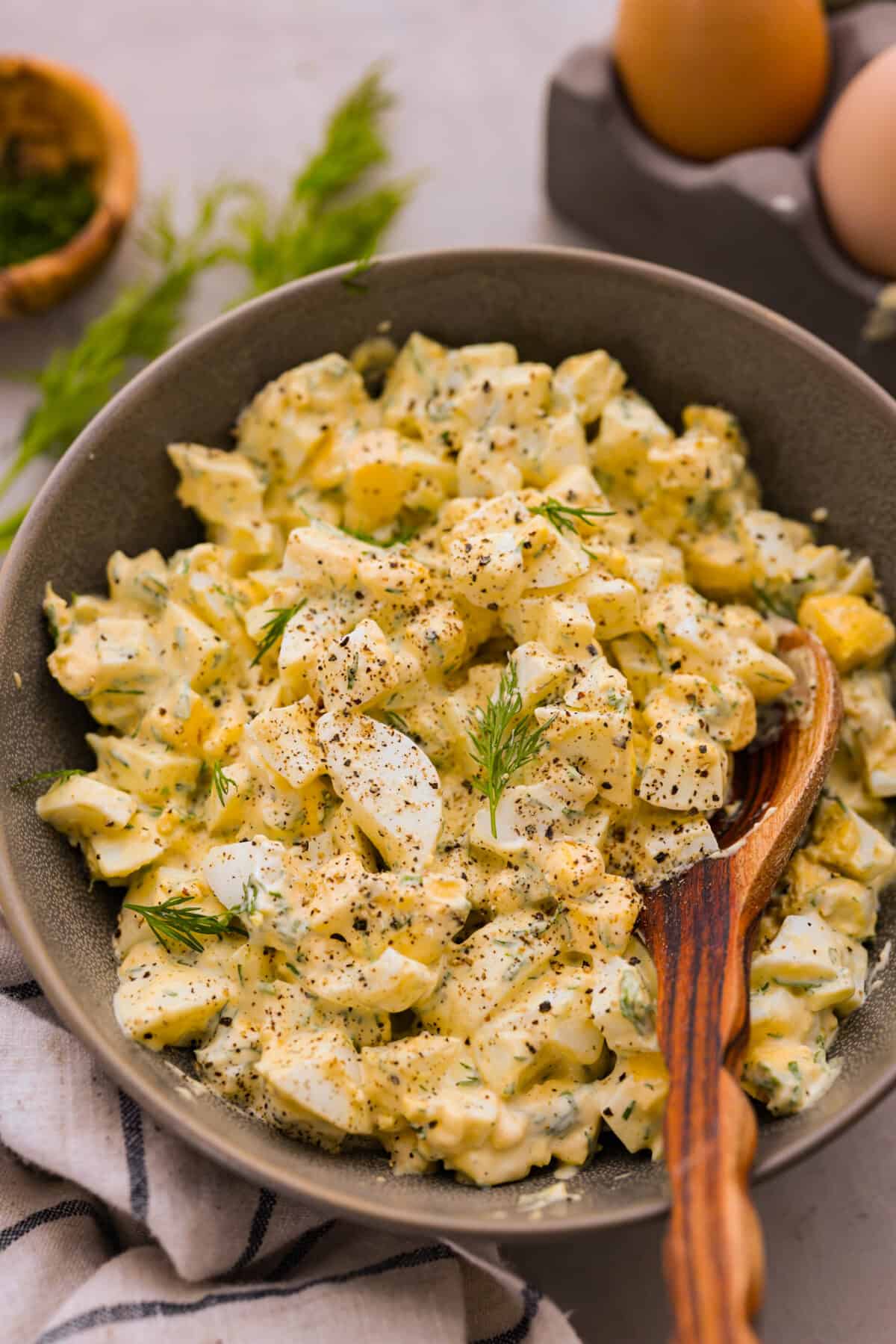 Egg salad in a gray bowl.