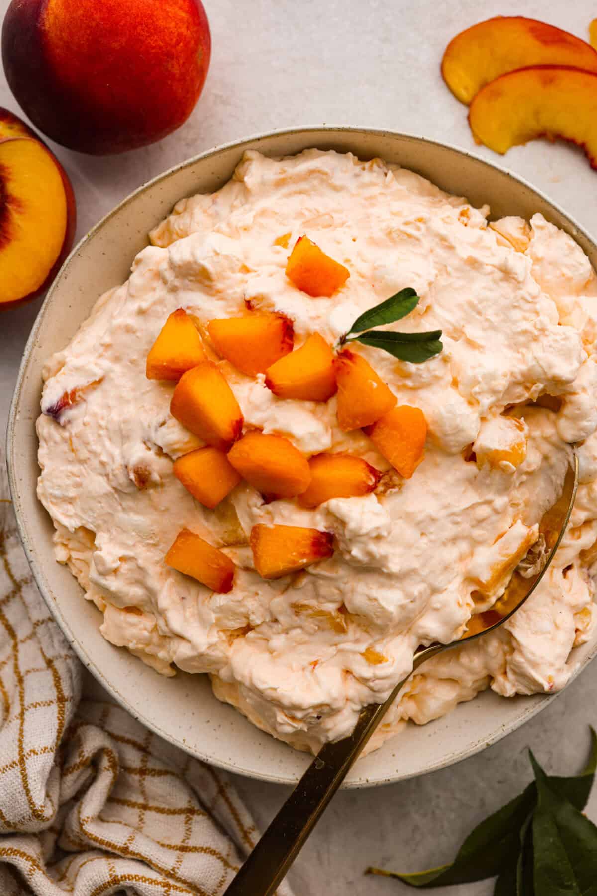 A bowl of peach fluff salad. 