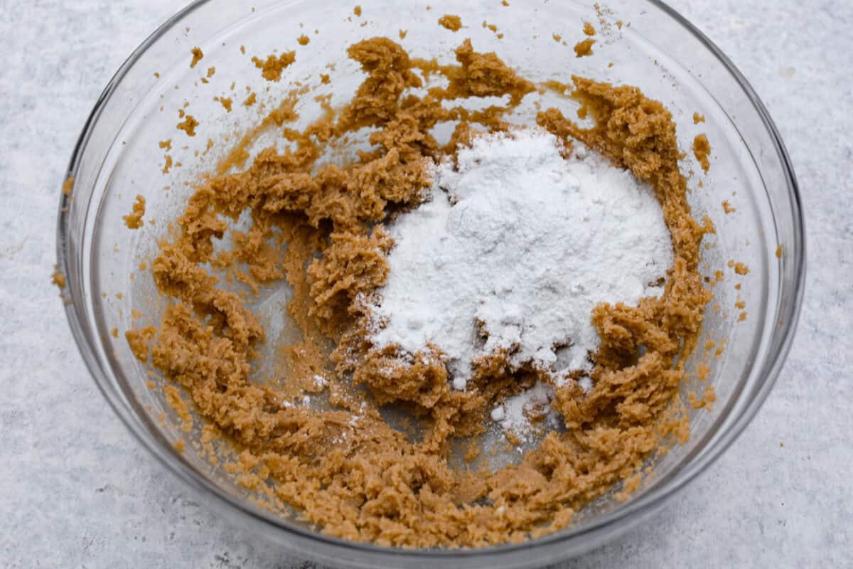 Overhead shot of beat butter and sugars with pudding mix on top. 