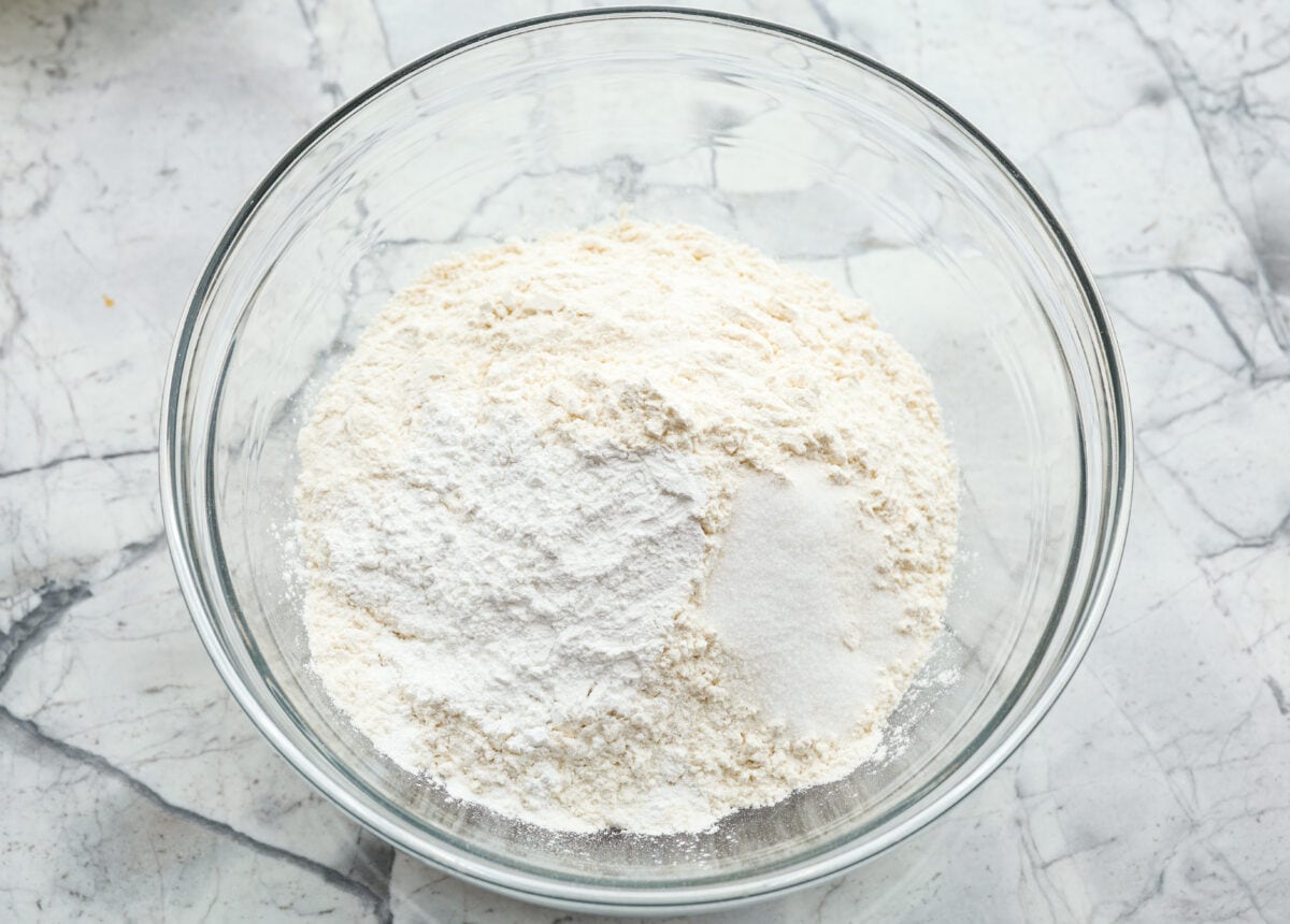 Overhead shot of dry ingredients in a glass bowl. 