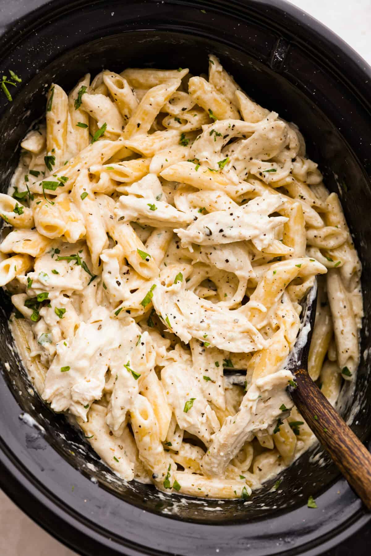 Overhead shot of crockpot chicken Alfredo. 