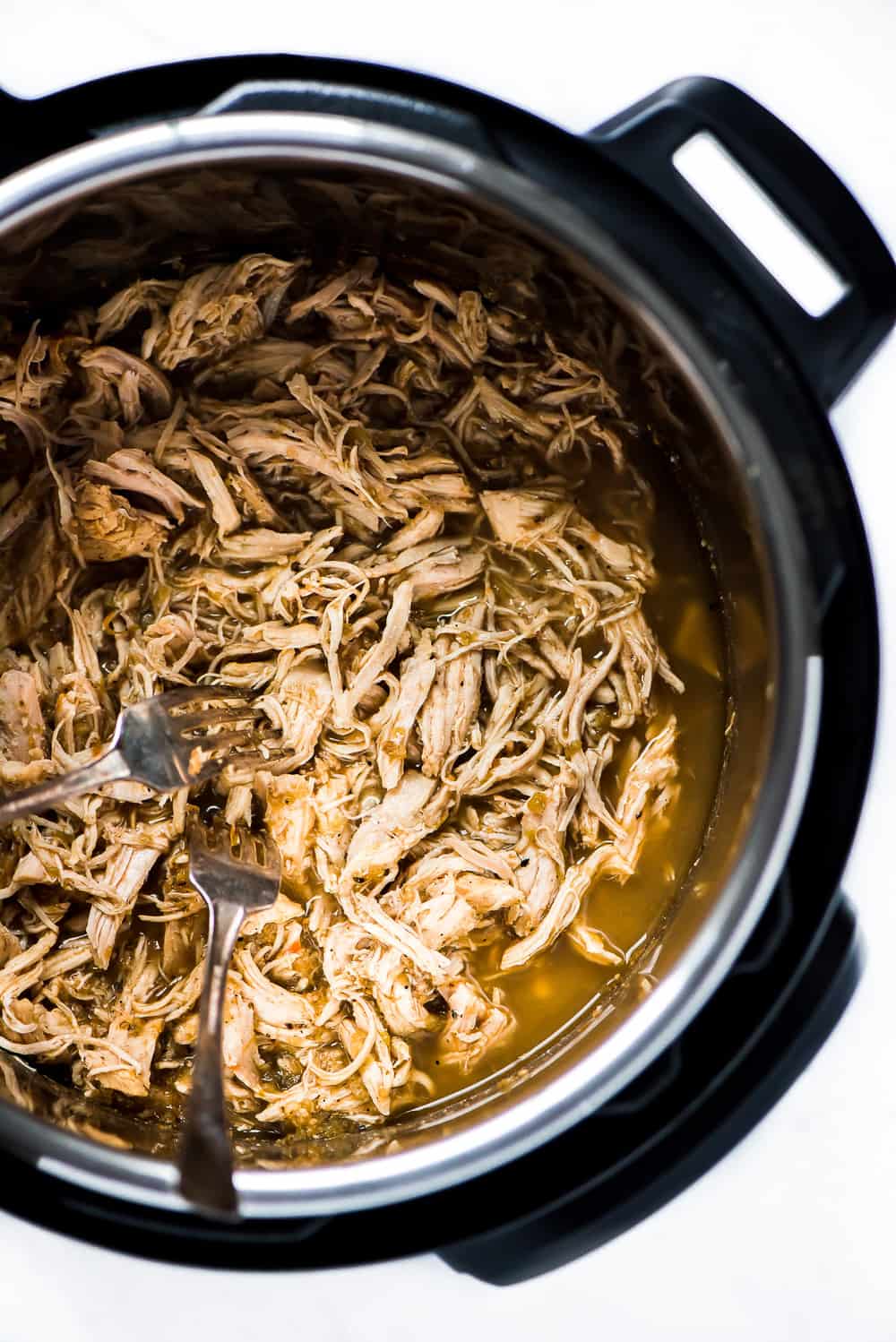 Top view of chicken shredded in an instant pot.