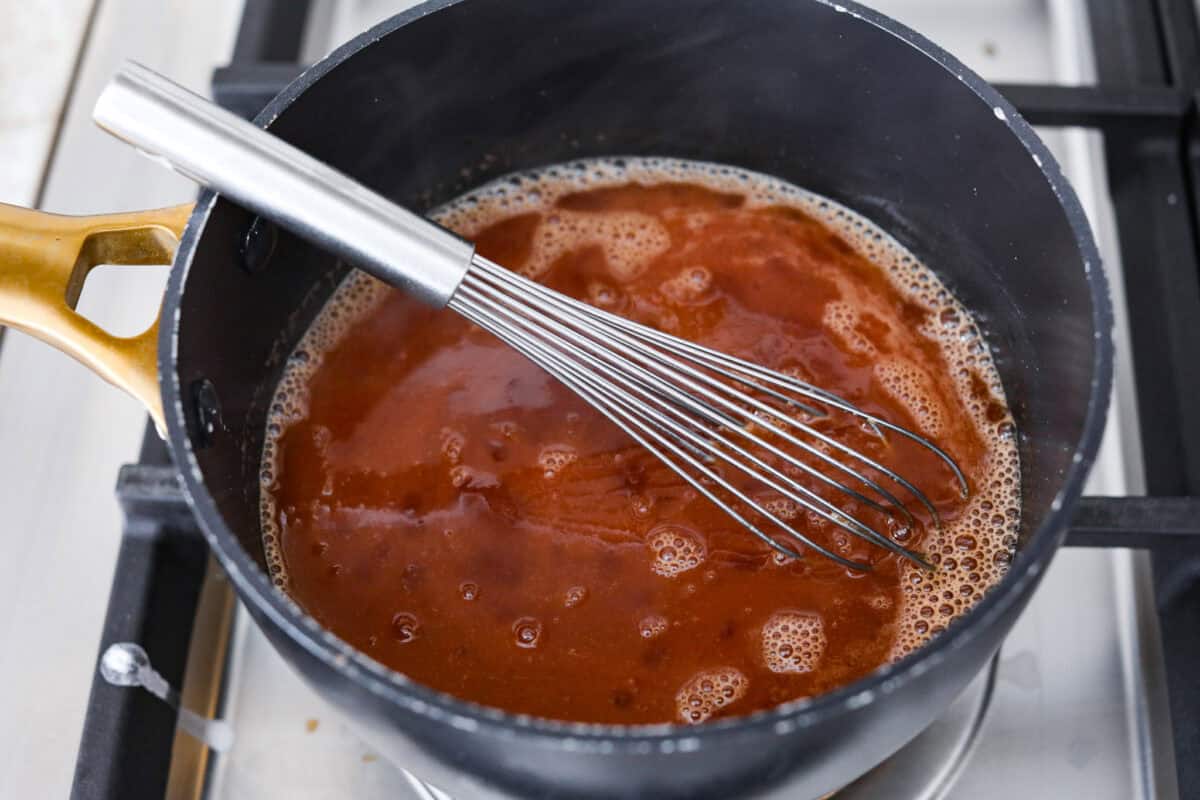 Overhead shot of sauce ingredients combined in a pan. 