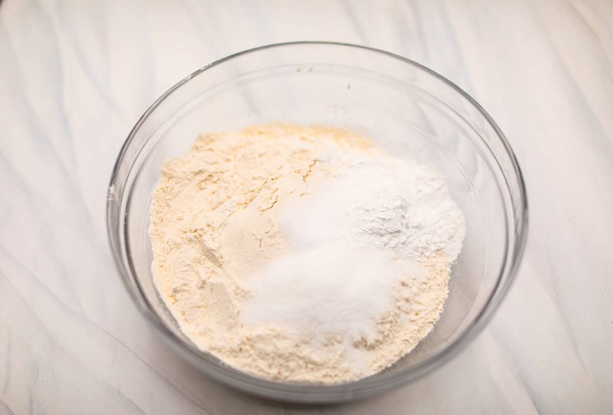 Overhead shot of dry ingredients in a glass bowl. 