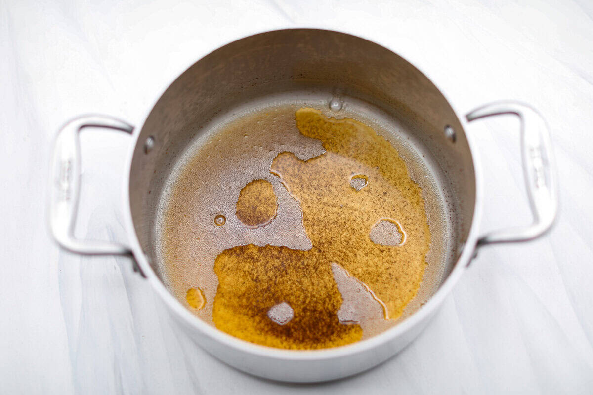 Overhead shot of the butter being melted and browned in a pot for the frosting.