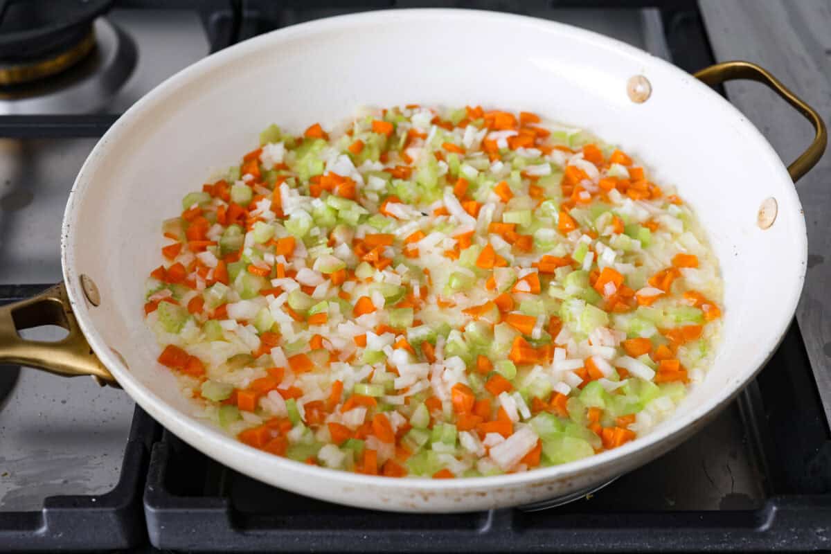 Third photo of the veggies cooking in a pan.