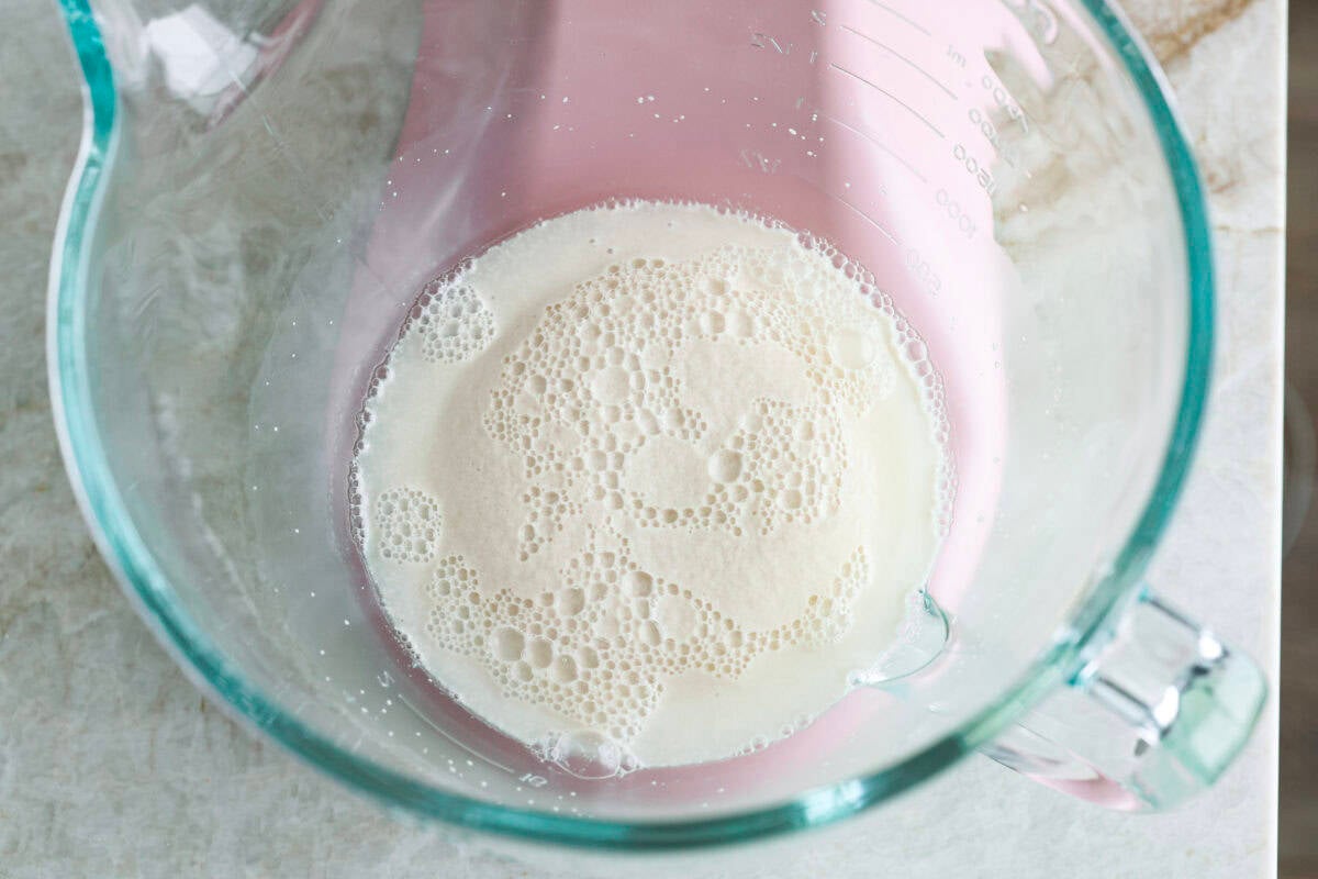 Warm water, yeast and sugar in the bottom of a mixing bowl. 