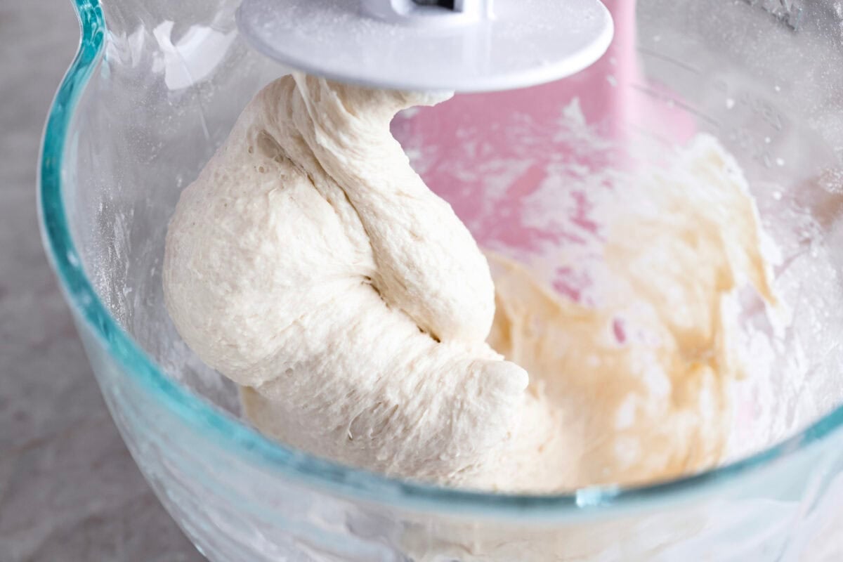 Dough being mixed with a stand mixer. 