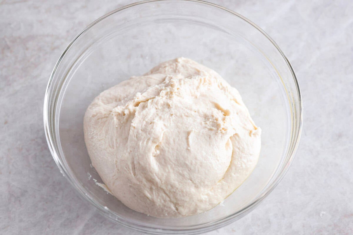 Breadstick dough ball in the bottom of a greased bowl. 