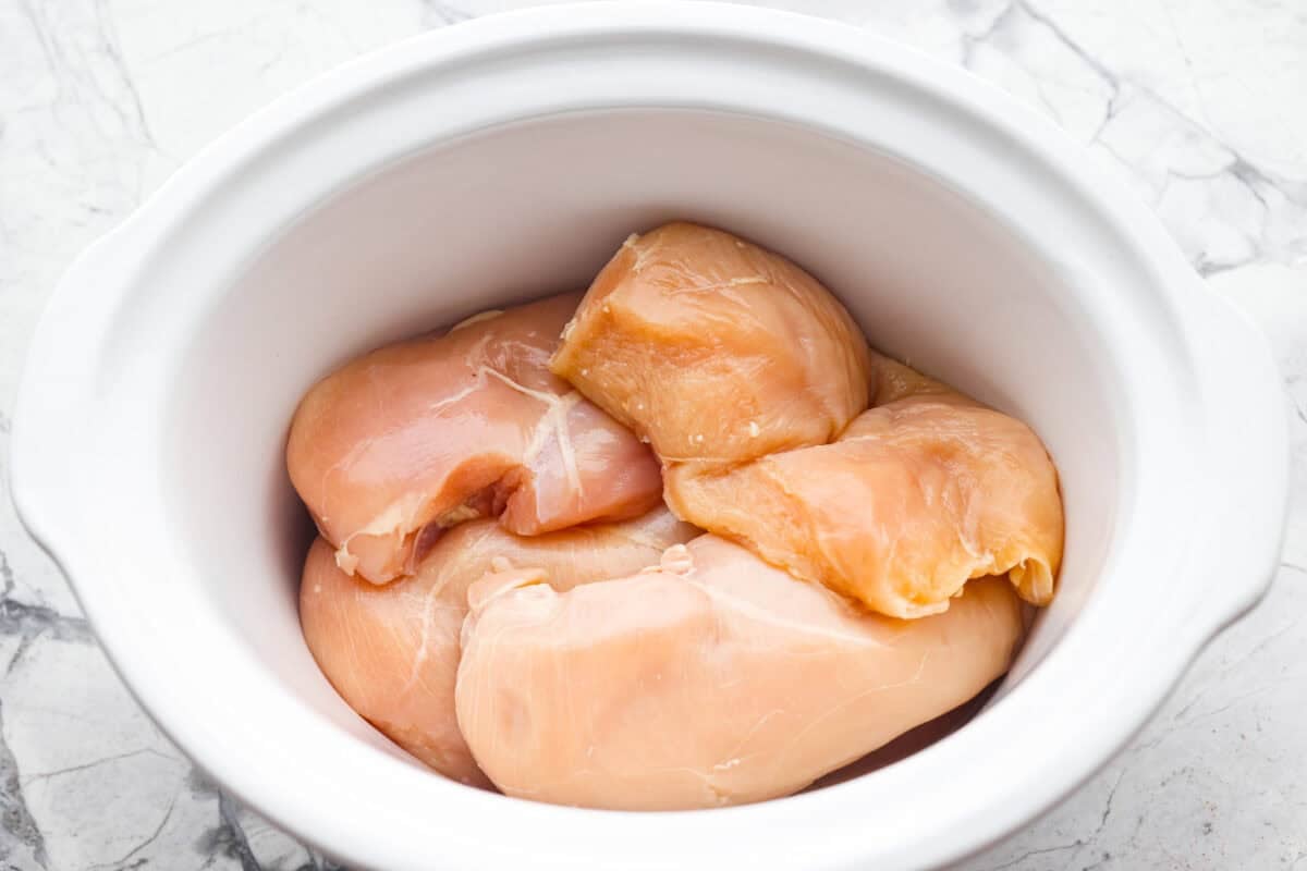 Chicken breasts in the bottom of the crockpot. 