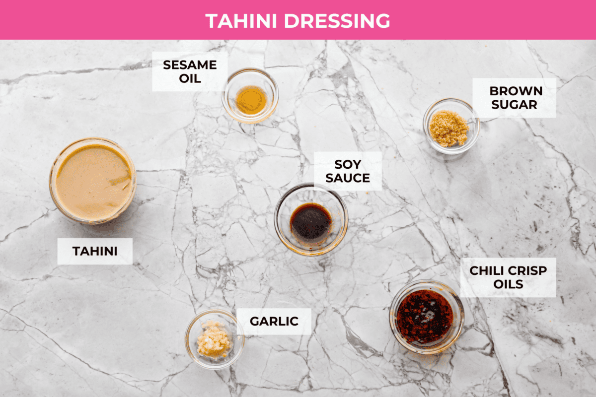 Overhead shot of labeled tahini dressing ingredients. 