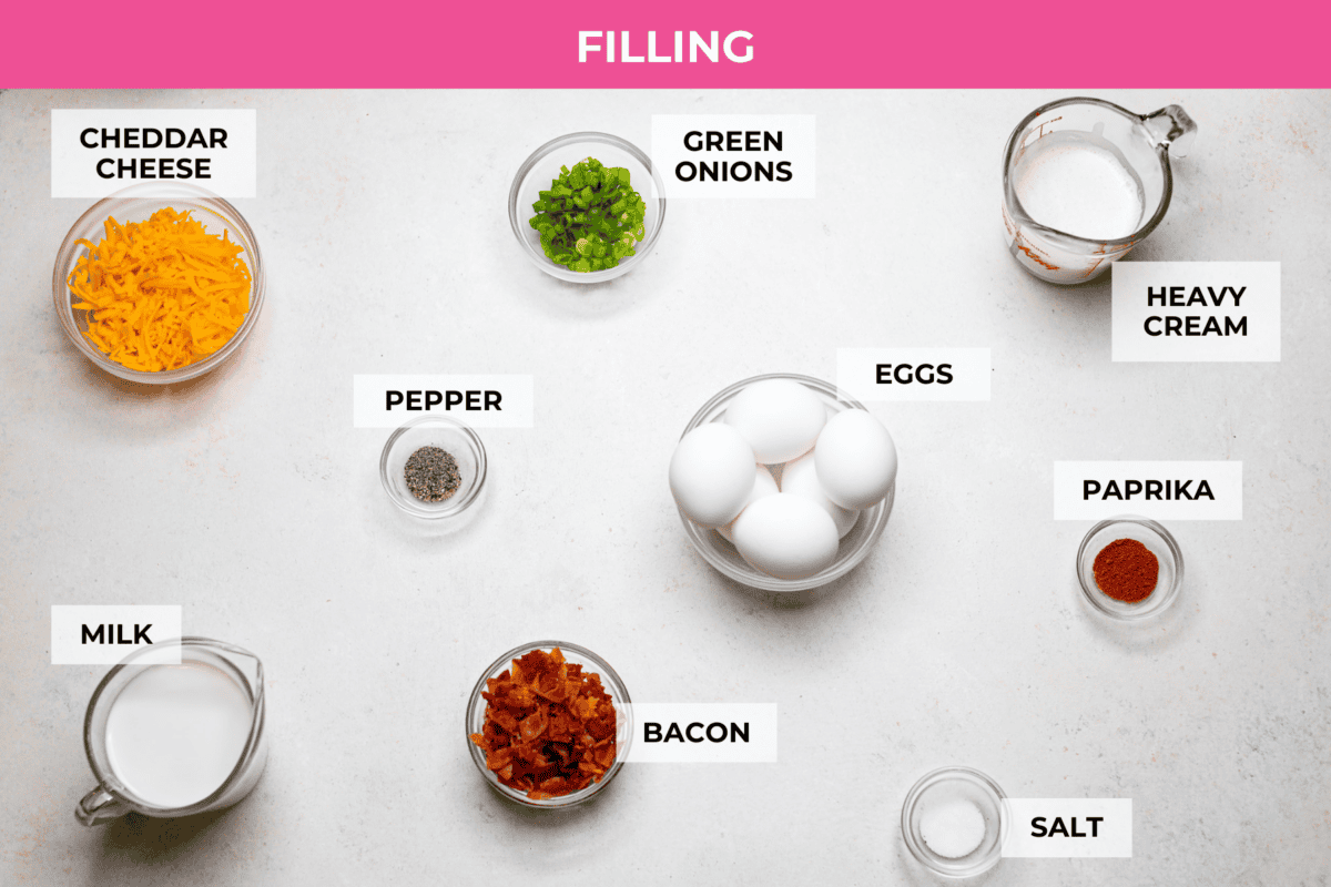 My Hash Brown Crust Quiche is a gluten-free twist on a classic! Crispy, golden potatoes wrap around a rich, savory, custardy filling. Brunch just got an upgrade! Overhead shot of labeled filling ingredients.