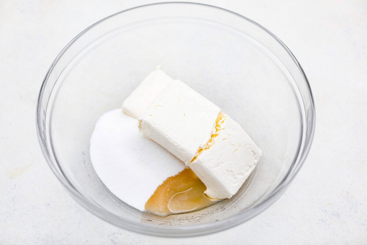 Cream cheese layer ingredients in a bowl. 