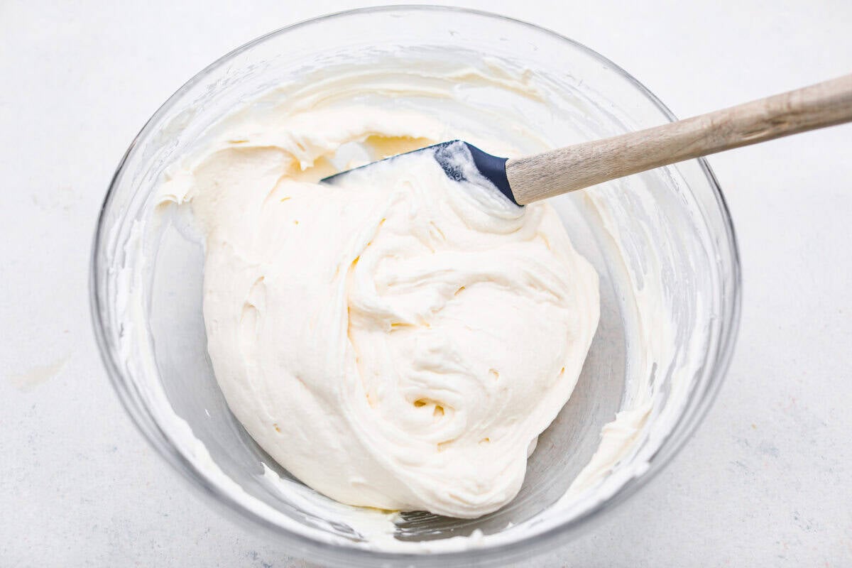 Cream cheese layer ingredients mixed together in a bowl.