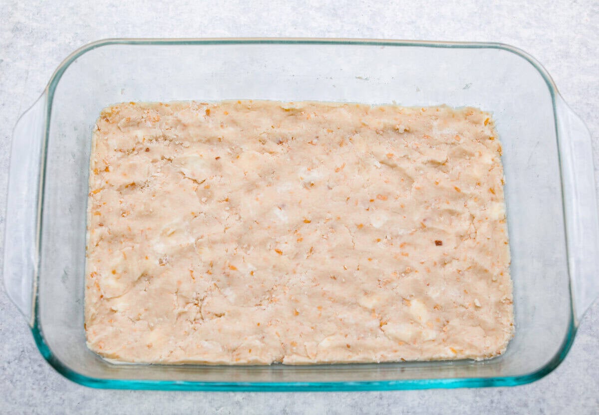 crust ingredients smashed at the bottom of a baking dish. 