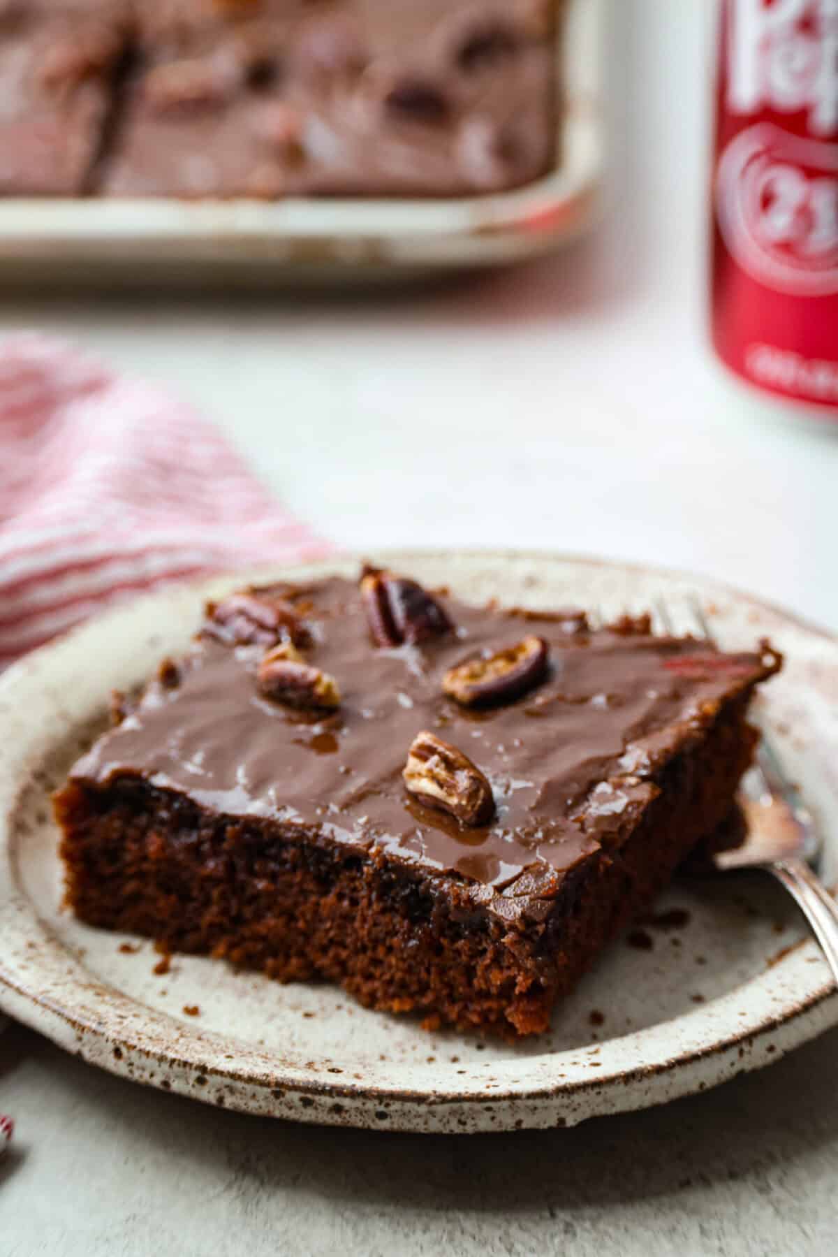 Angle shot of a slice of Dr. Pepper Sheet cake