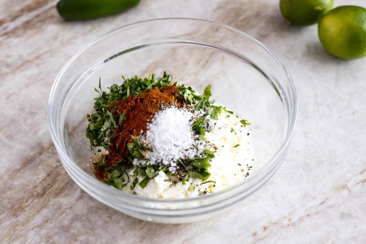 Dressing ingredients all added to a bowl. 