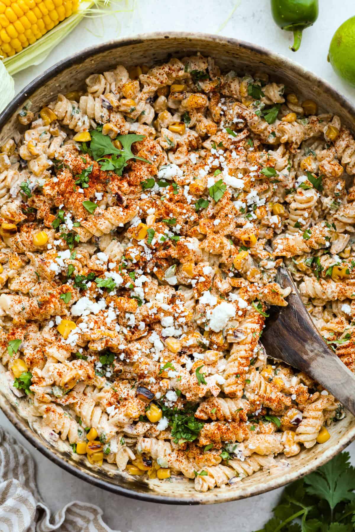 Overhead shot of elote pasta salad in a serving bowl. 