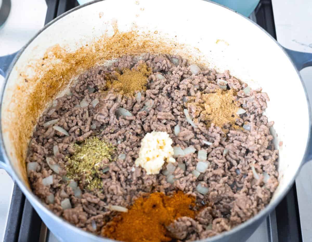 Seasonings added to the cooked ground beef. 
