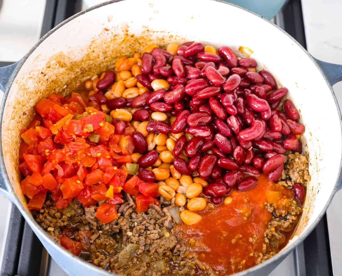 Beans, tomato sauce, beef broth, and Rotel tomatoes added to the beef. 
