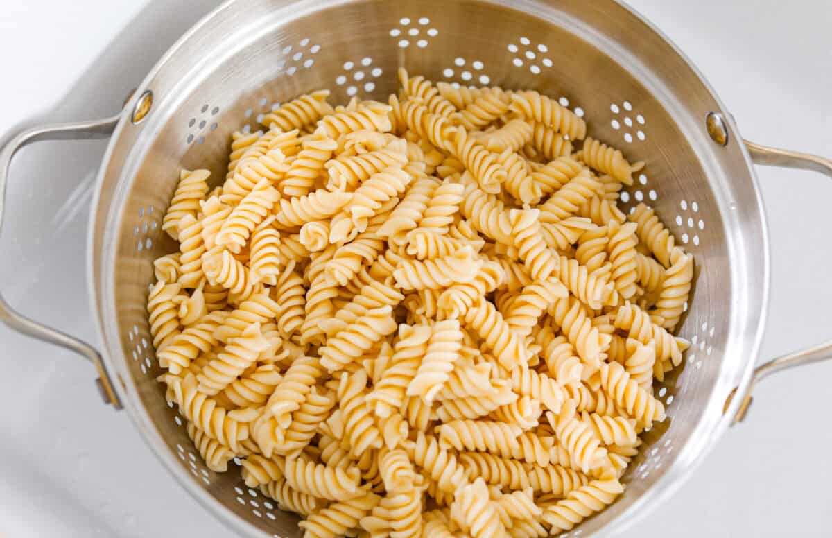 Colander of cooked al dente pasta. 