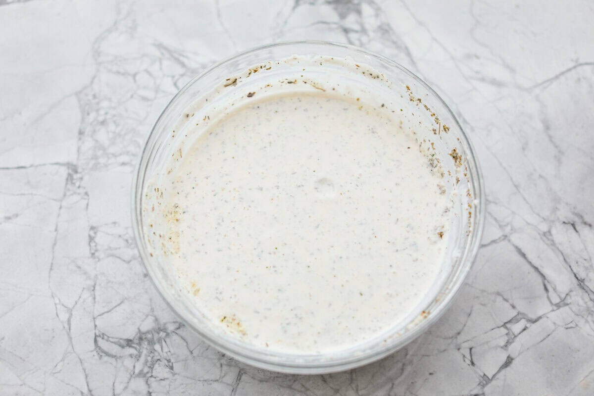 Bowl with Ranch dressing ingredients mixed together. 