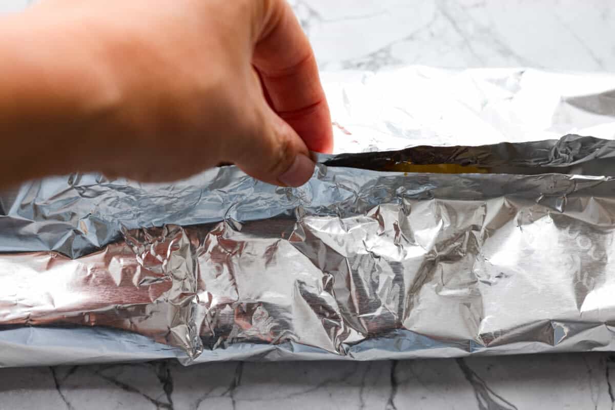 Someone sealing up the foil packets. 