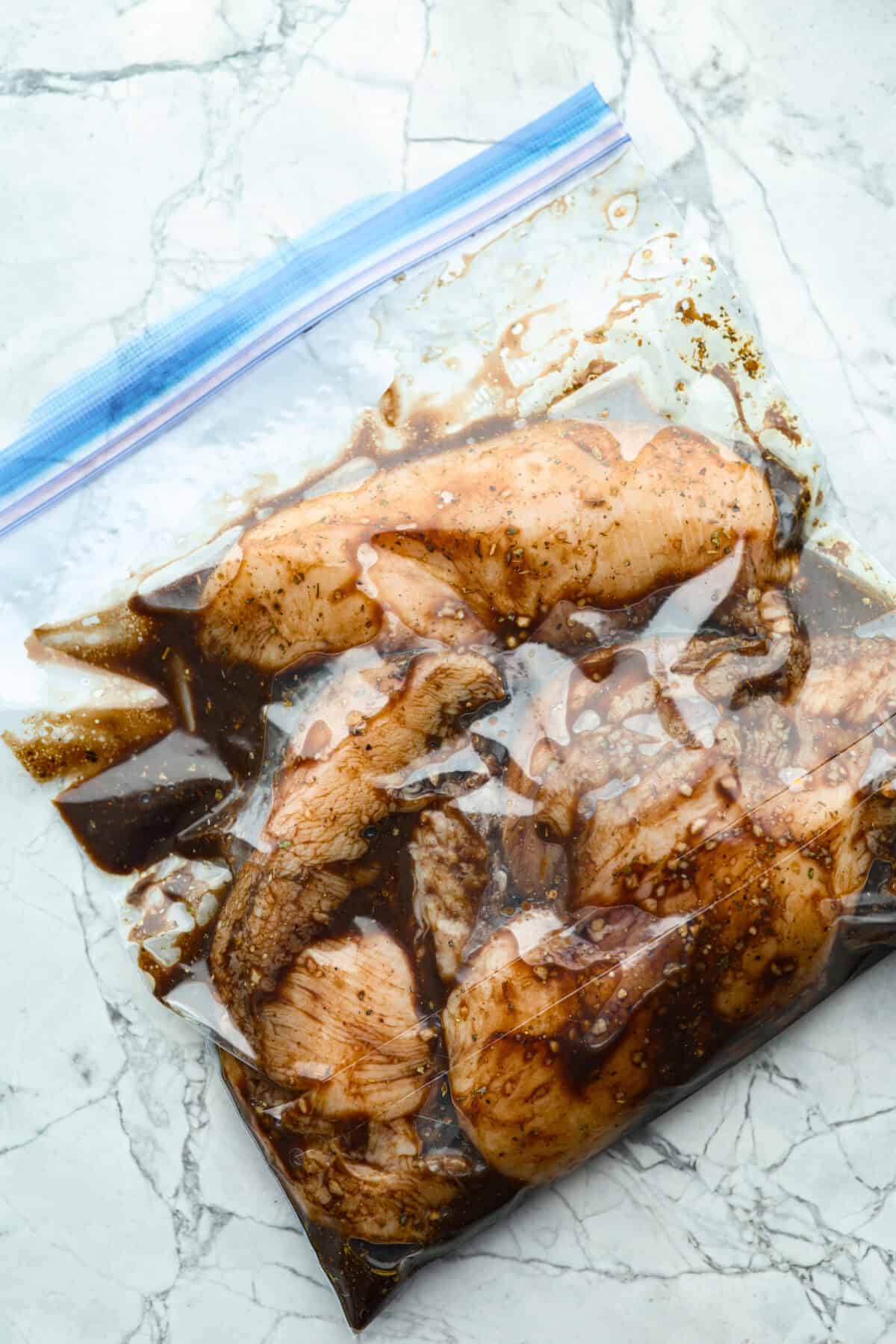 Bag of raw chicken in the balsamic chicken marinade. 