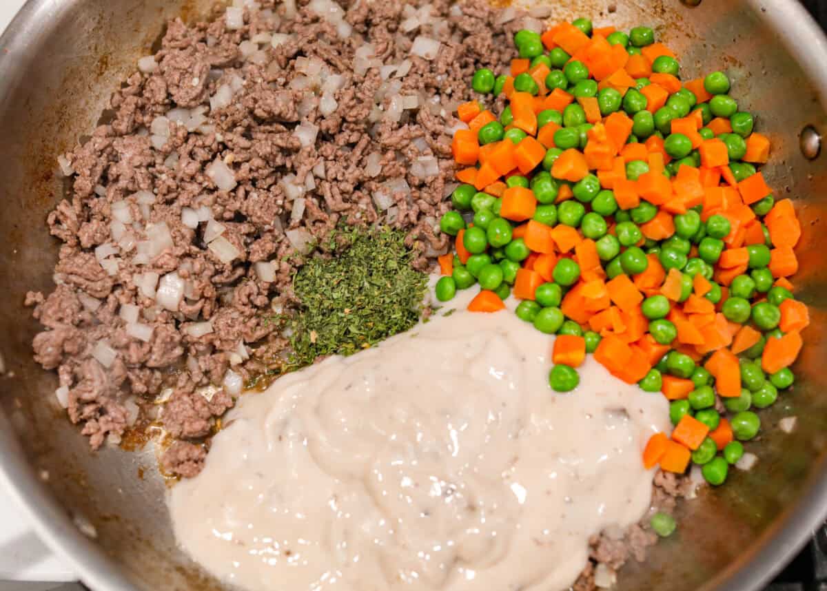Veggies and soup mix added to the cooked ground beef. 