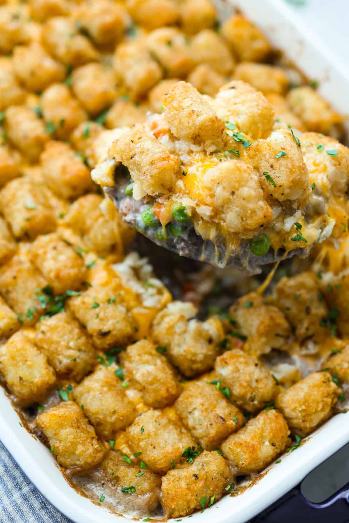 Close up of the scoop of tater tot casserole. 