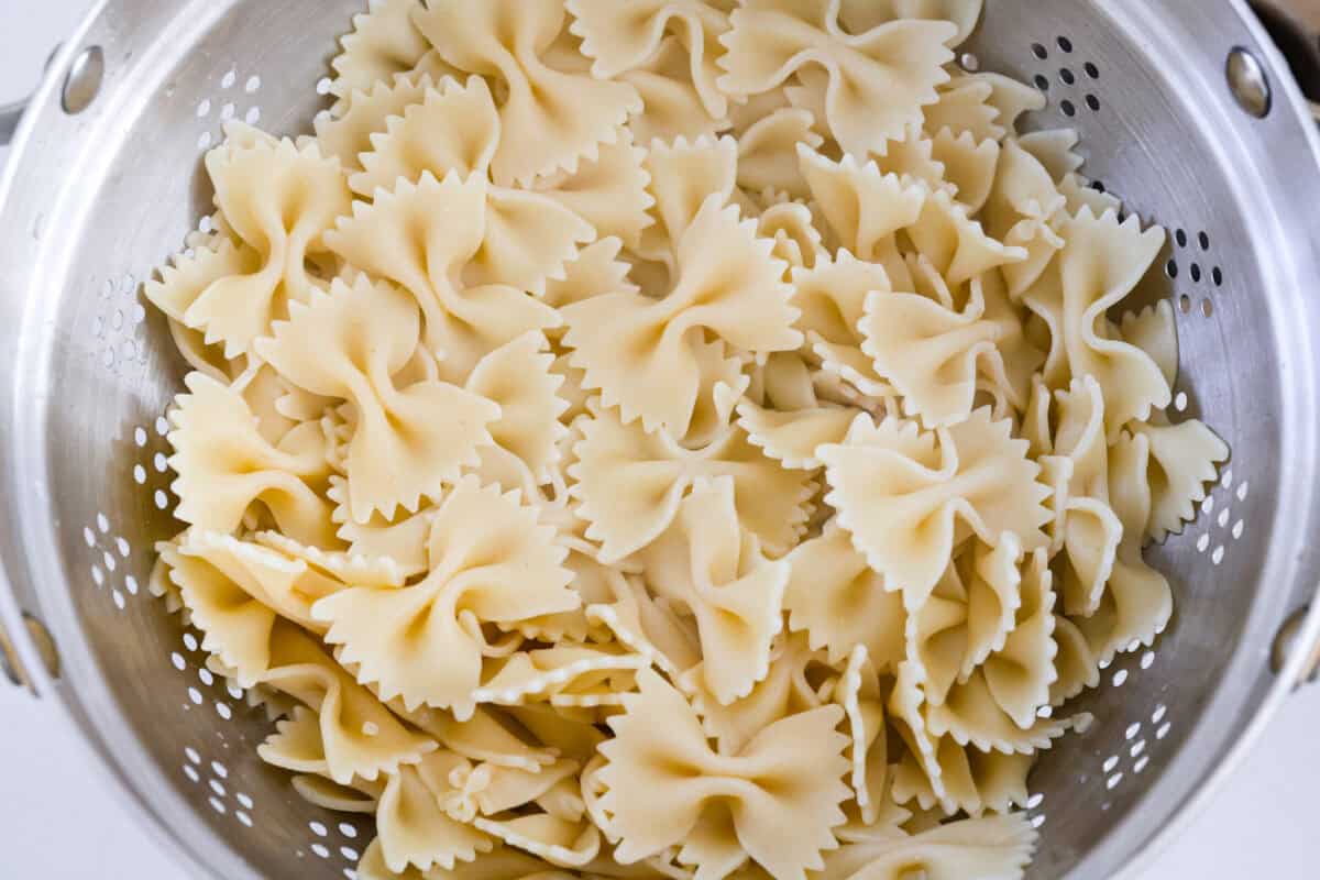Cooked and drained pasta in a colander. 