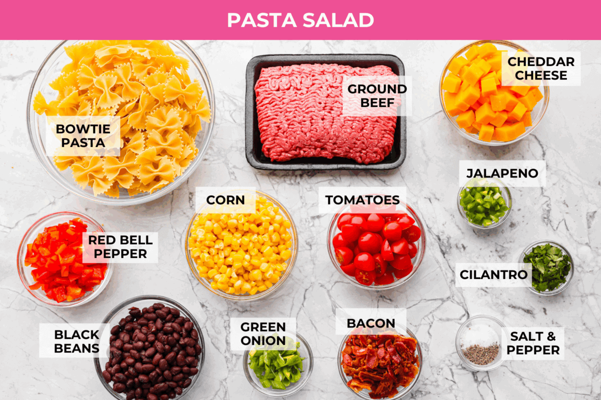 Overhead shot of labeled pasta salad ingredients. 