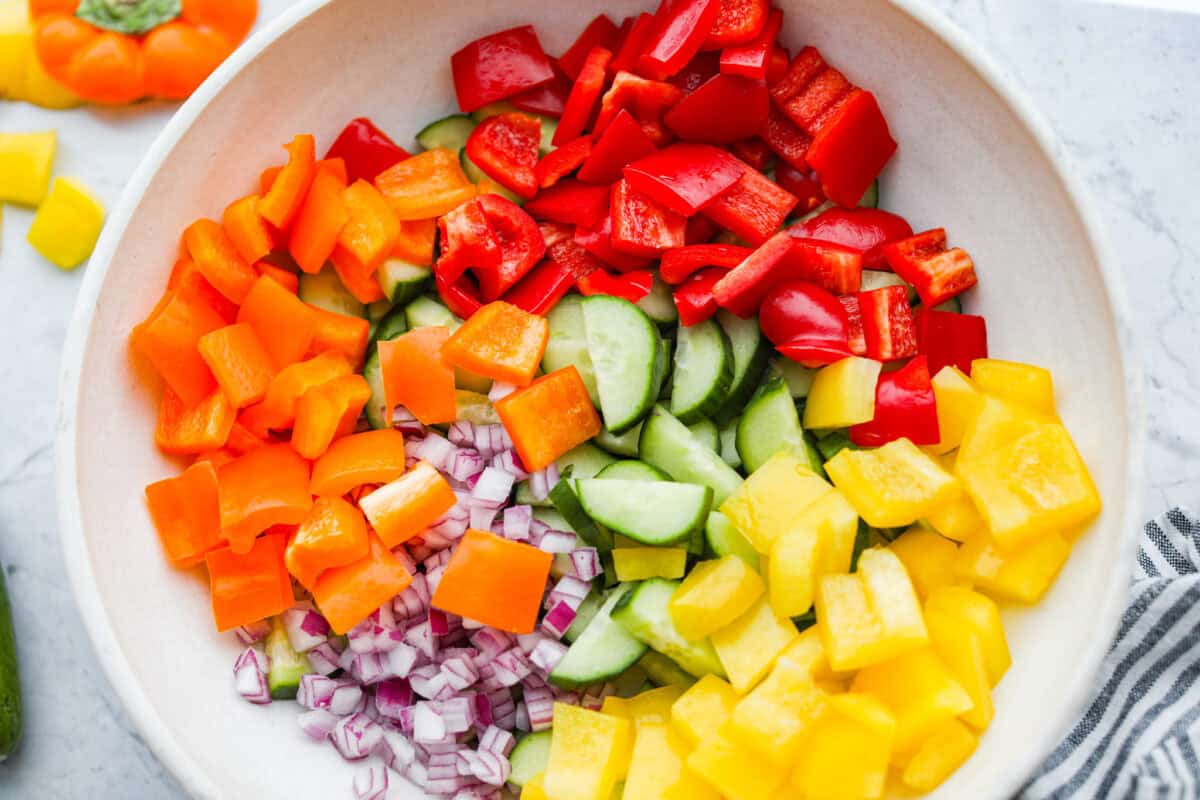 Bowl of chopped up vegetables. 