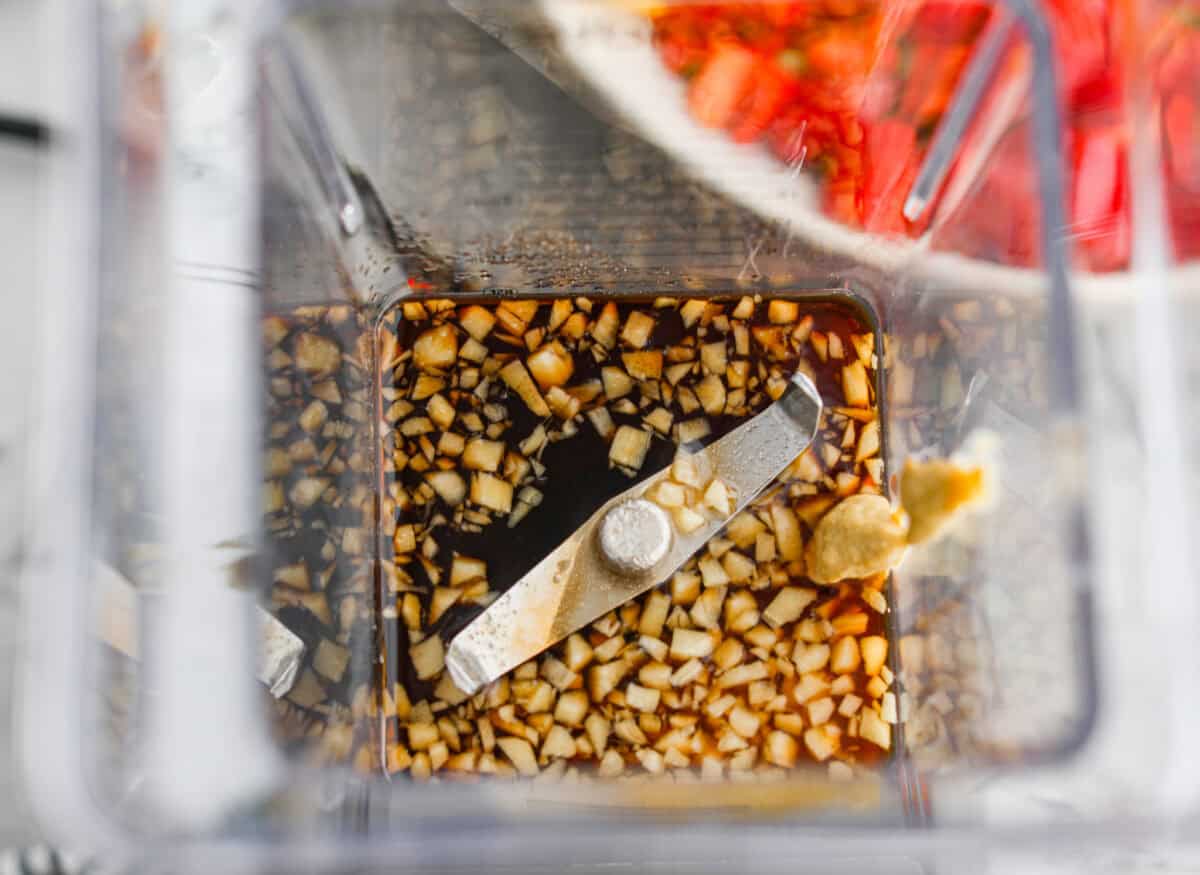 Overhead shot of the dressing ingredients added to the blender. 