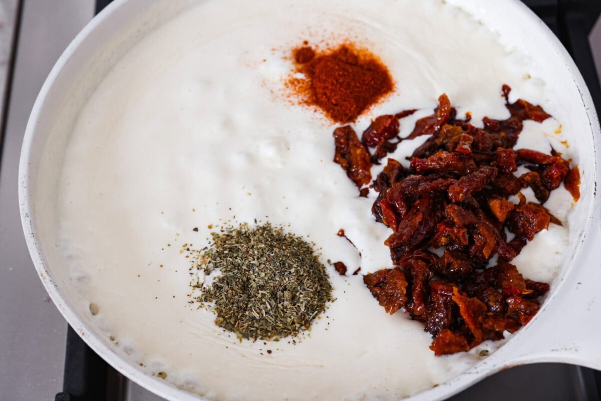 Seasonings and sun dried tomatoes added to the cream sauce. 