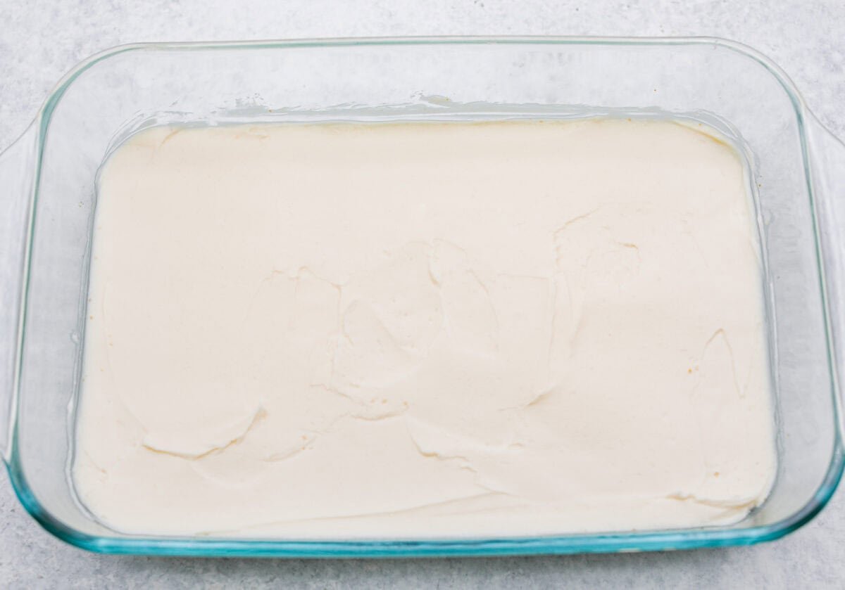 Cream cheese and butter mixture spread over baked and cooled crust.