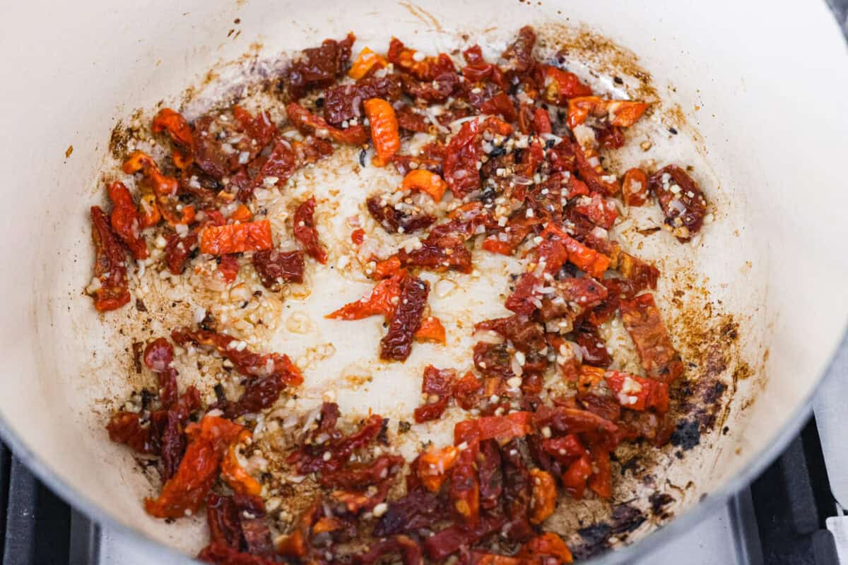Sun-dried tomatoes cooking in the shallots and garlic. 