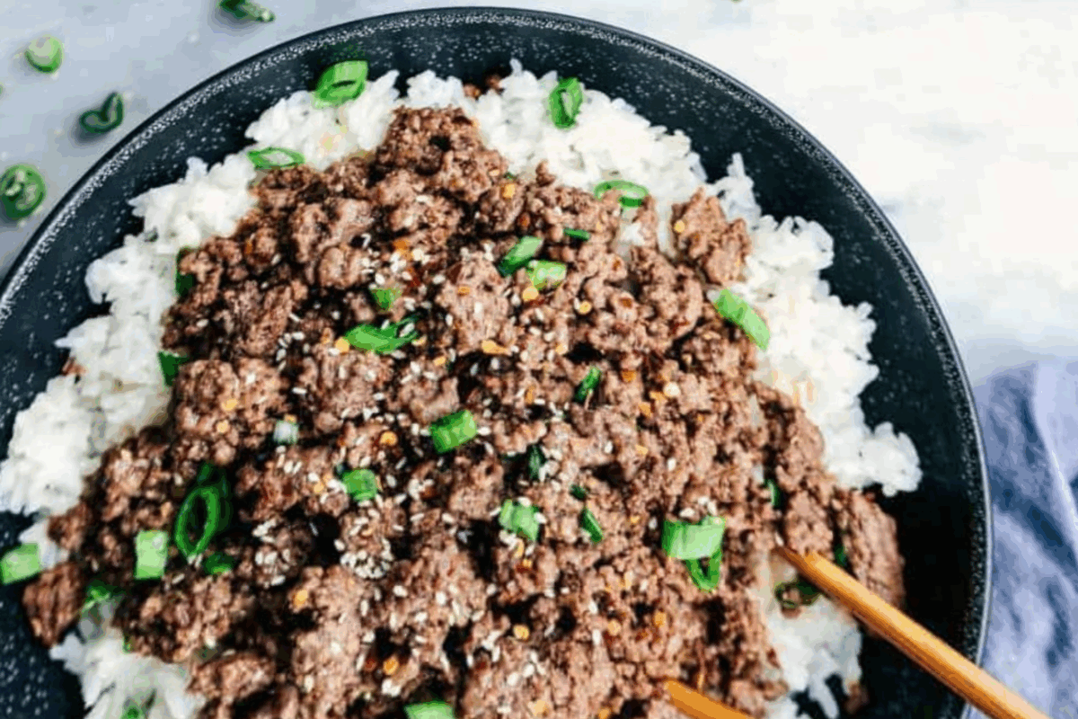 Whether you’ve got 20 minutes or a single sheet pan, these dinners will rescue your night (and your sanity). Korean Beef and Rice Bowl with chopsticks.