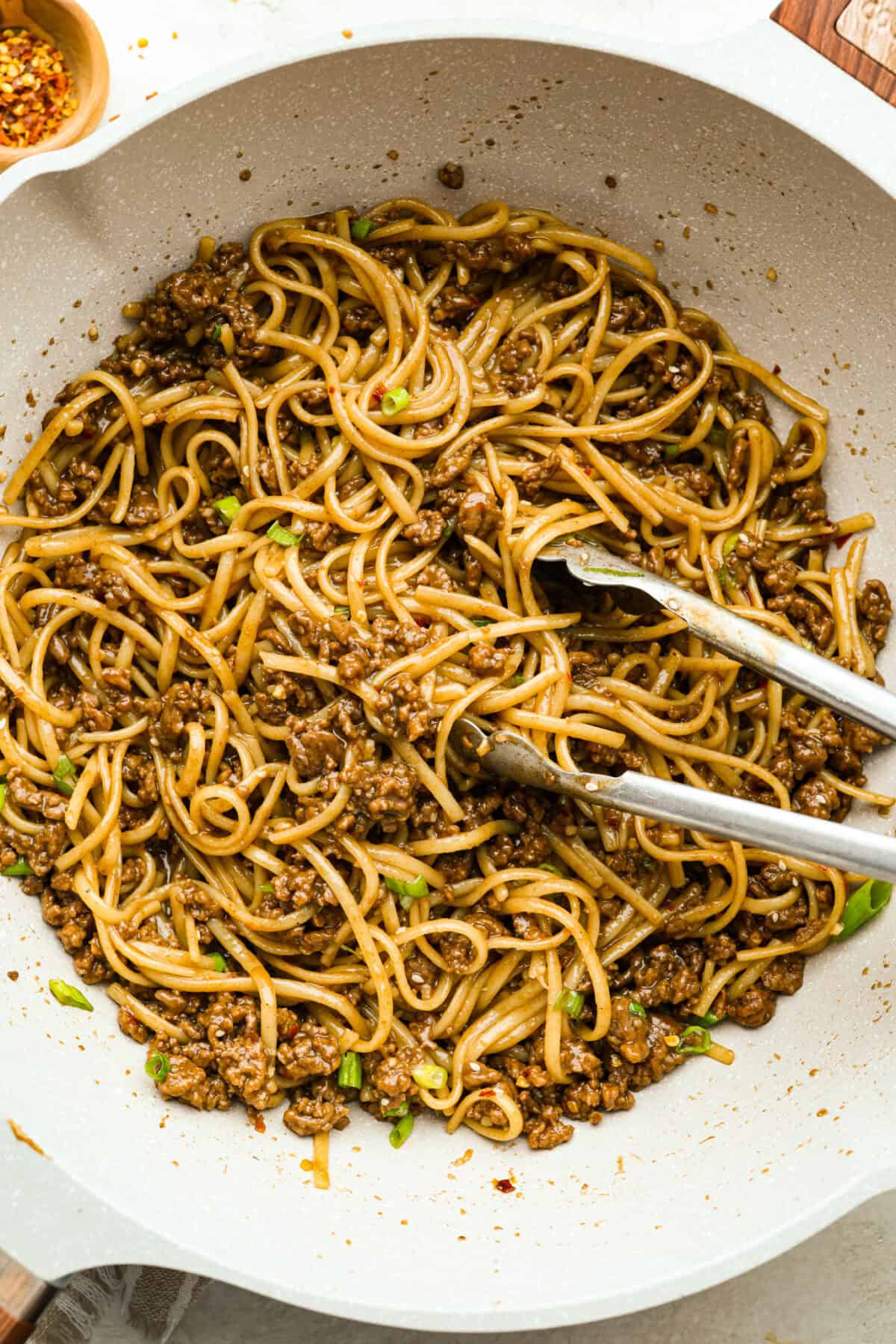 Overhead shot of a skillet with Korean beef noodles in it. 