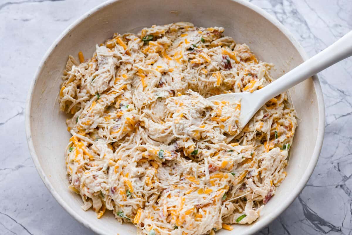 Casserole ingredients in a bowl mixed together. 