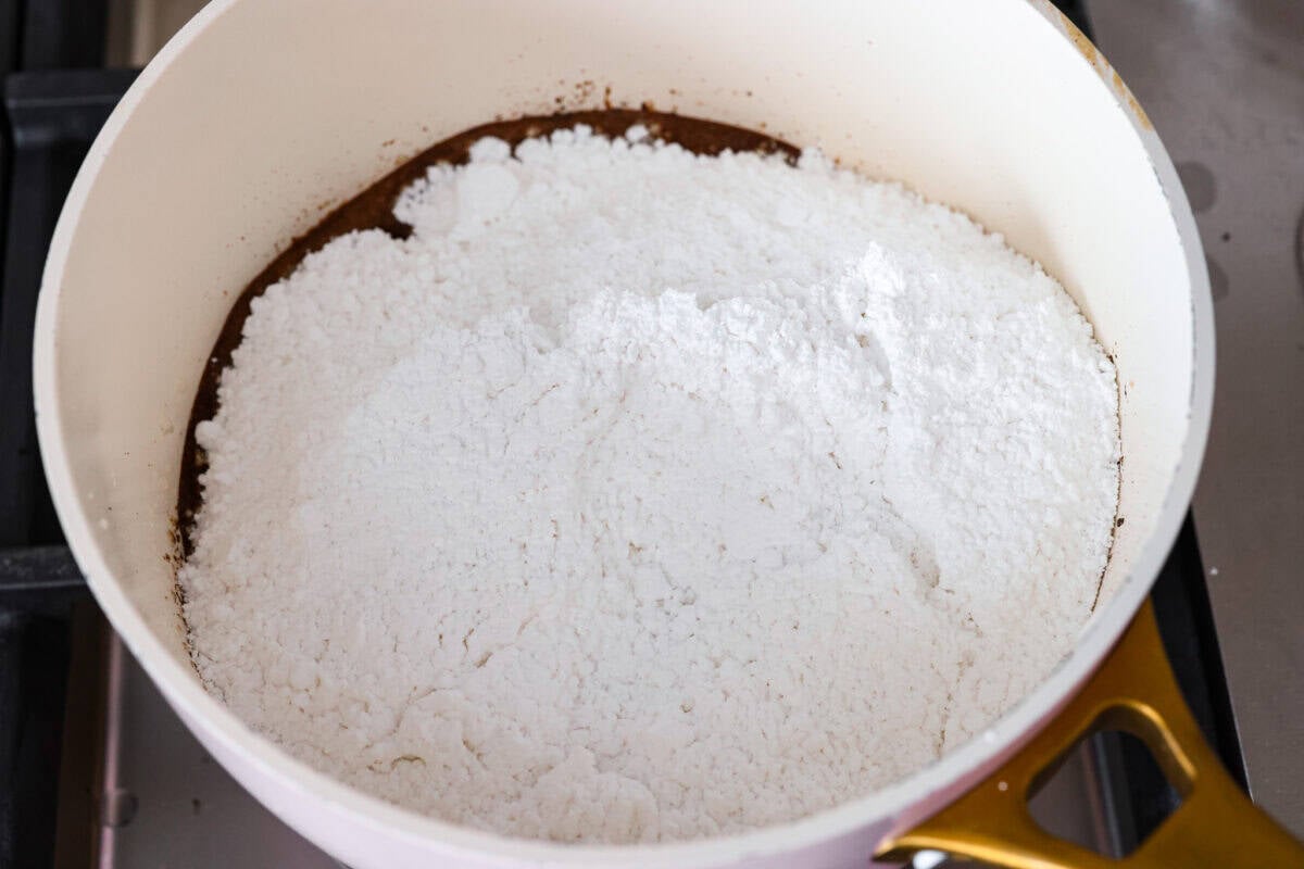 If you grew up in Utah, Lunch Lady Peanut Butter Bars were basically a rite of passage. Thick, chewy, and slathered in chocolate frosting. My version is even better, and yes, this one earned its spot in my cookbook for a reason. Powdered sugar added to the melted butter and cocoa powder.