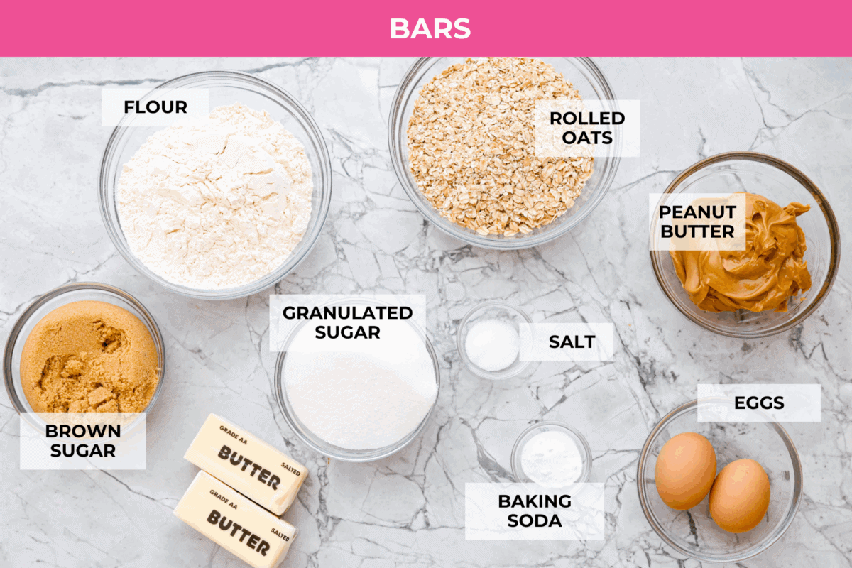 If you grew up in Utah, Lunch Lady Peanut Butter Bars were basically a rite of passage. Thick, chewy, and slathered in chocolate frosting. My version is even better, and yes, this one earned its spot in my cookbook for a reason. Overhead shot of labeled peanut butter bar ingredients.