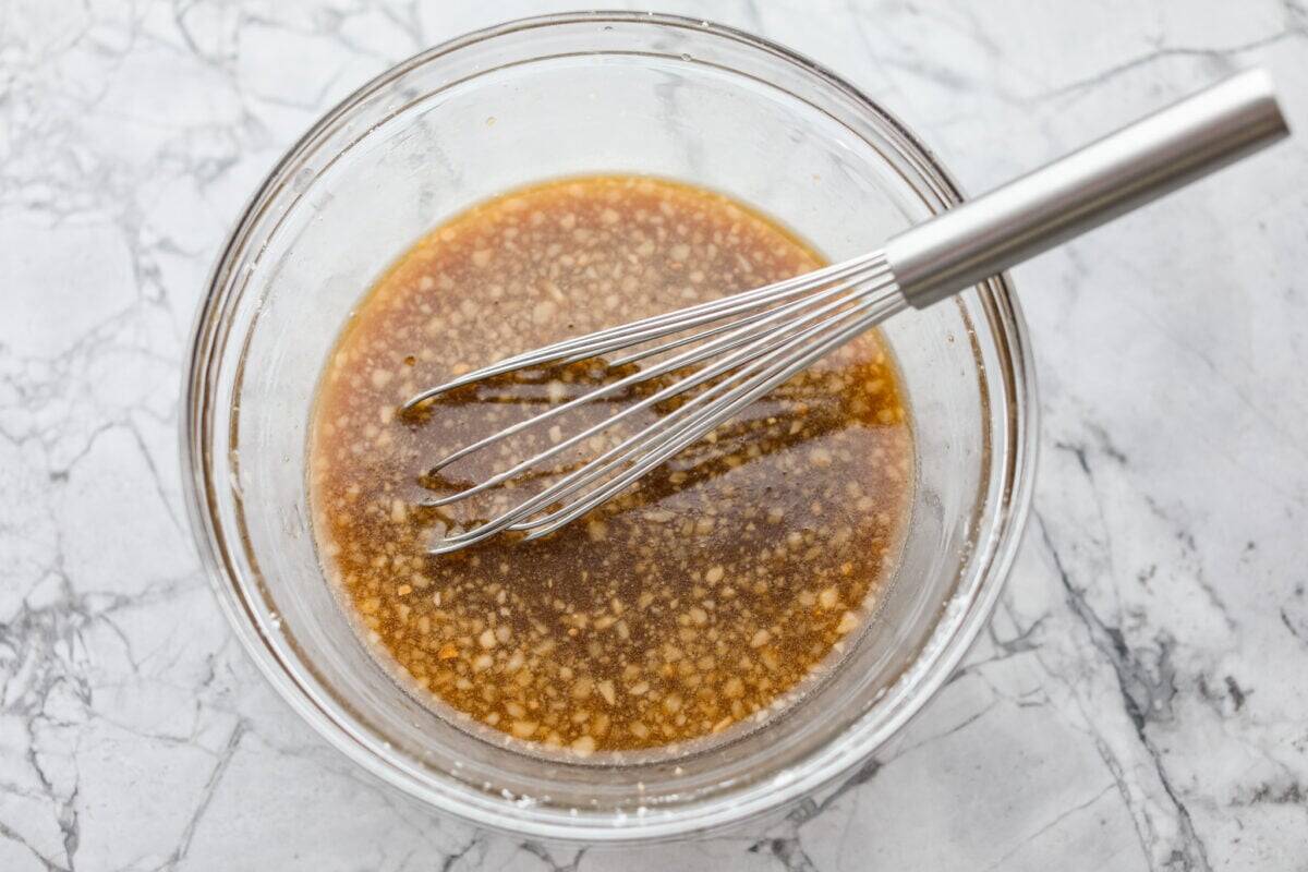 Garlic shrimp stir fry sauce ingredients whisked together in a bowl. 