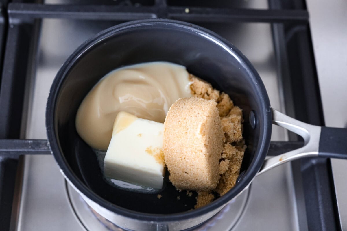 Sweetened condensed milk, sugar, and butter in a saucepan. 