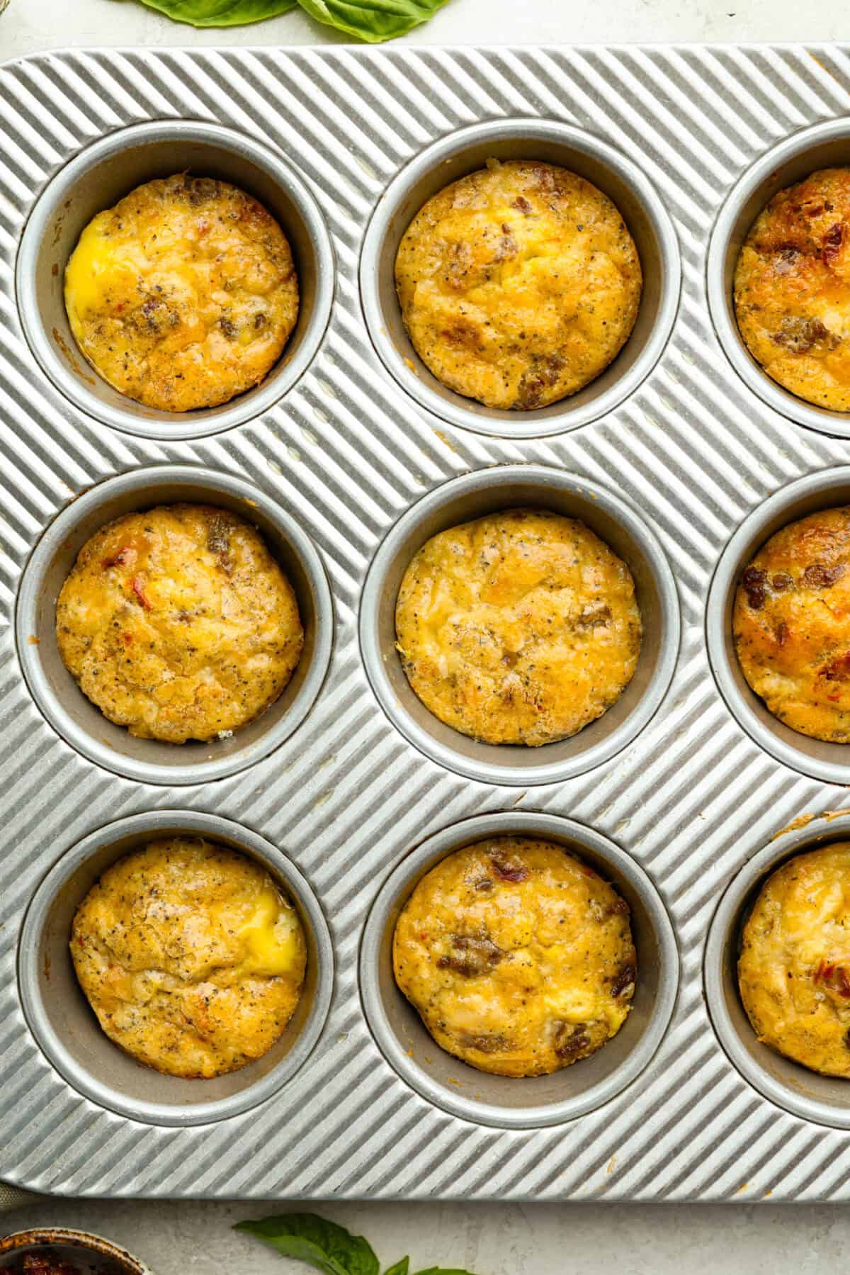 Overhead shot of Starbucks copycat Italian sausage egg bites cooked in muffin tin.